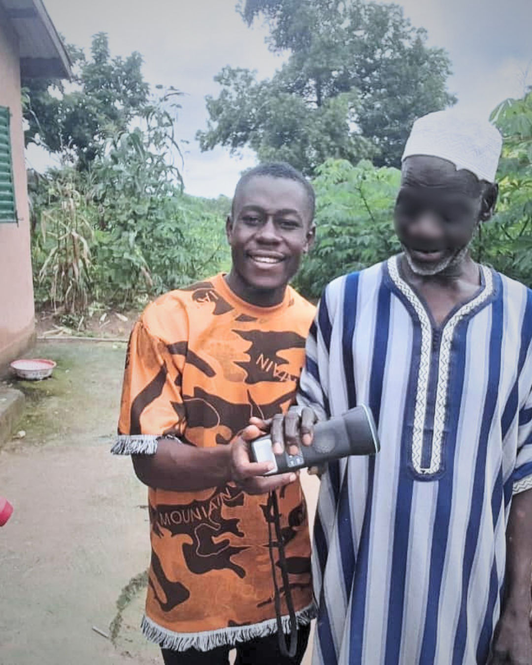 evangelist-presenting-villager-with-solar-audio-bible